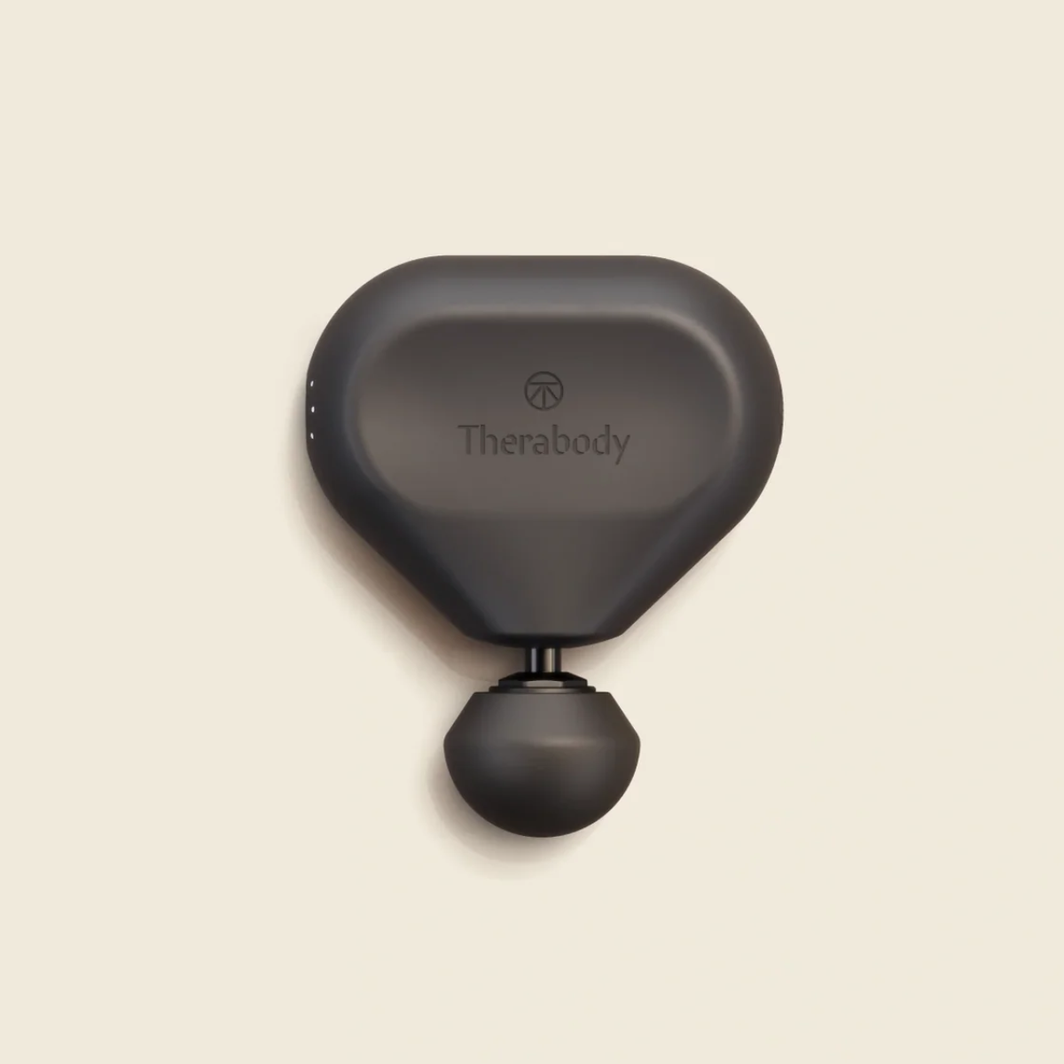 A black Theragun Mini portable percussive massager, shown as a luxury relaxation and wellness gift for employees.