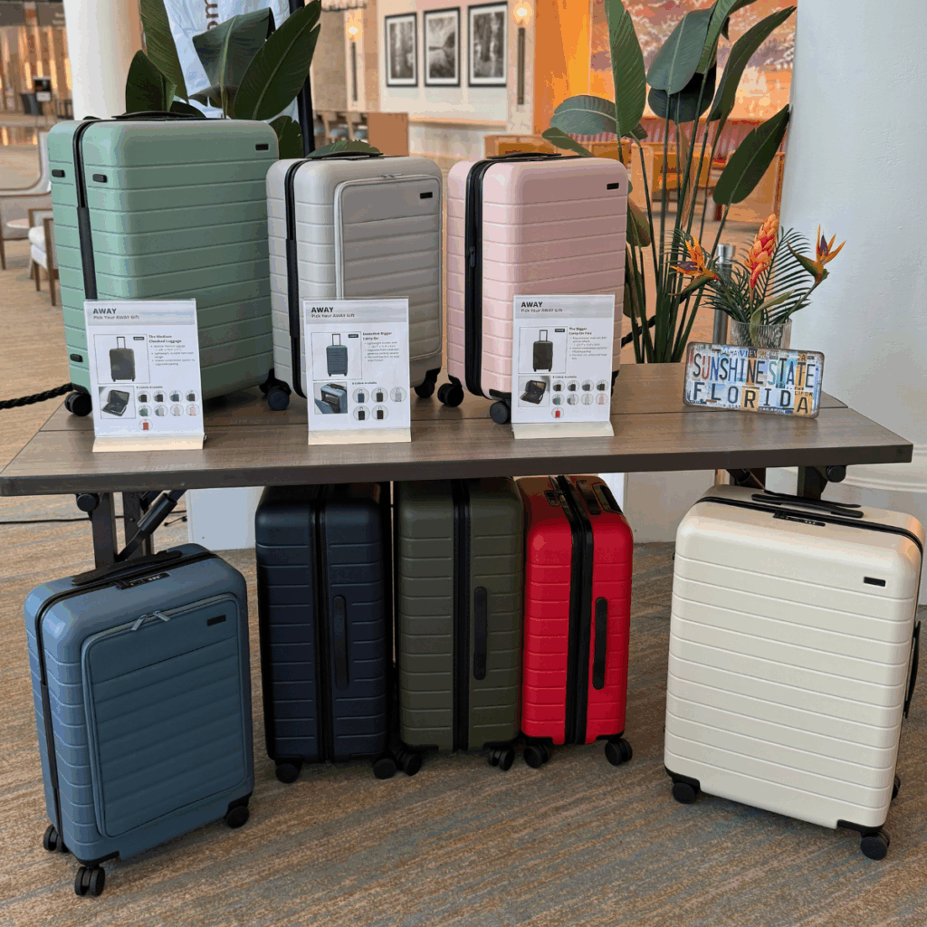 Onsite corporate gifting experience featuring premium luggage and travel accessories at a live gifting event.